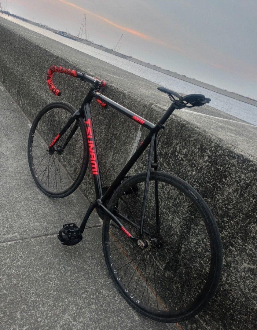 Fixie tsunami (Category: Announcements) located in Manila. Submitted by wfiies (Listing ID 1454412093, Image 1). Description: FOR SALE ONLY TSUNAMI WHOLE BIKE Location:Parañque City Specs: -Frame: Tsunami (black/pink) size XL -Fork:Tsunami (black/pink) -Stem: Uno stem repainted to black -Dropbar: Uno (silver) repainted to black matte Seatpost: Ragusa Saddle: Inspeed Seatclamp: tsunami stock Wheelset: H-plus son Hubs: Geestar Tires: Chaoyang Cogs: