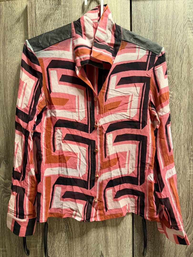 Gianni Versace Ss 2001 Geometric set (Category: Luxury Apparel) located in Manila. Submitted by fashionshyt (Listing ID 1454522827, Image 3). Description: This sheer, lightweight button-up shirt features a striking, bold op-art pattern that is part of the iconic Versace Spring/Summer 2001 ready-to-wear runway collection designed by Donatella Versace.This specific presentation heavily prioritized vibrant, retro-futuristic patterns. It drew direct 
