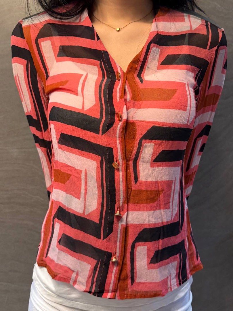 Gianni Versace Ss 2001 Geometric set (Category: Luxury Apparel) located in Manila. Submitted by fashionshyt (Listing ID 1454522827, Image 2). Description: This sheer, lightweight button-up shirt features a striking, bold op-art pattern that is part of the iconic Versace Spring/Summer 2001 ready-to-wear runway collection designed by Donatella Versace.This specific presentation heavily prioritized vibrant, retro-futuristic patterns. It drew direct 