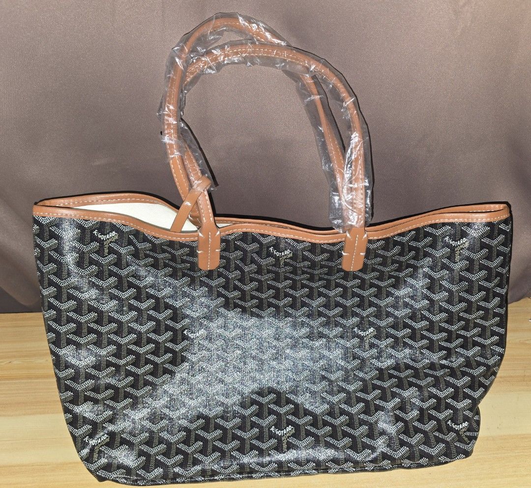 Goyard St. Louis Tote Bag (Category: Luxury Bags & Wallets) located in Quezon City. Submitted by shapaholiq_04 (Listing ID 1454397036, Image 1). Description: - Classic Goyard tote bag - Features the iconic chevron pattern - Tan leather trim and handles - Handles still have protective plastic on - Spacious interior - Ideal for everyday use or travel not OG.