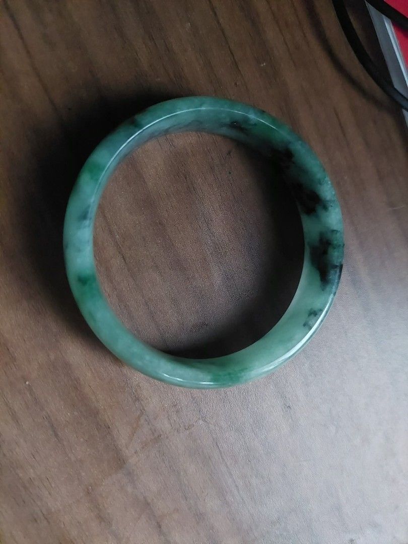 Green Jadeite Bangle Bracelet (Category: Bracelets) located in Manila. Submitted by kriziealix123 (Listing ID 1454416681, Image 1). Description: - Genuine green jade bangle - Natural stone with unique, beautiful patterns - Translucent quality when held to light - Smooth, comfortable finish - Versatile accessory for any style - Inner diameter: approximately 58mm.