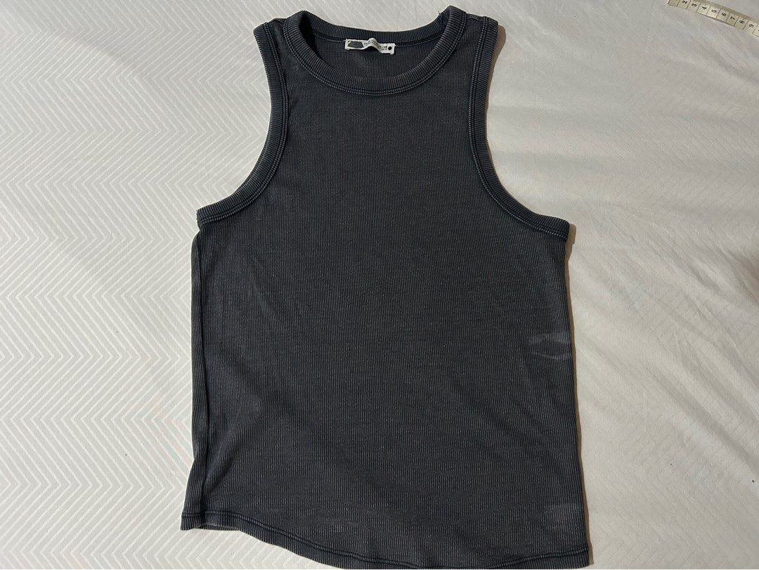 Grey Ribbed Tank Top (Category: Sleeveless) located in Manila. Submitted by fromrie (Listing ID 1454469288, Image 2). Description: - Grey ribbed tank top - Sleeveless design - Fits like a size Small or Medium - Textured fabric for a nice feel - Versatile for layering or wearing on its own.