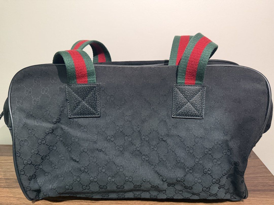 Gucci GG Monogram Canvas Tote Bag with Web Stripe (Category: Luxury Bags & Wallets) located in Quezon City. Submitted by bravonov24 (Listing ID 1454535081, Image 2). Description: - Authentic Gucci GG monogram canvas tote bag - Iconic red and green web stripe detail on handles - Genuine leather trim and handles - Spacious interior for daily essentials - Features interior Gucci leather tag and serial number - A timeless and classic Gucci piece - wi