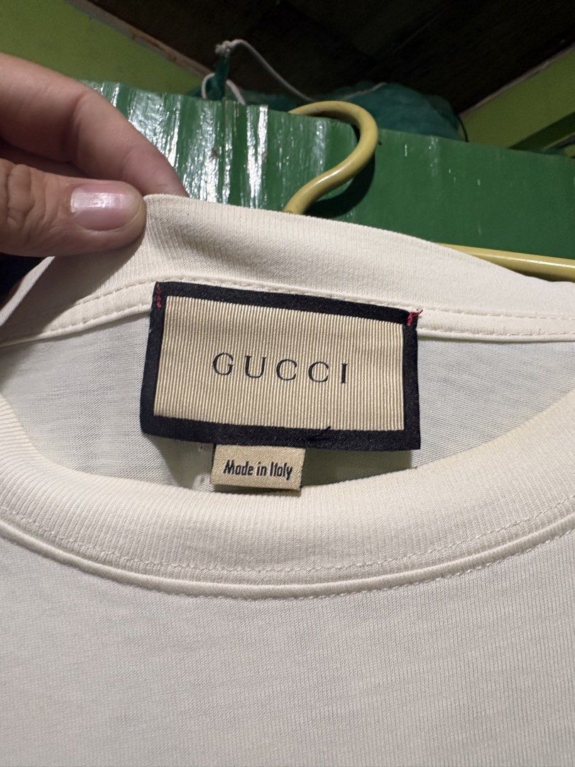 Gucci shirt (Category: Luxury Apparel) located in Manila. Submitted by jacebased (Listing ID 1454518287, Image 2). Description: 8/10 Signs of minimal stains and stretch neck line Large on size (to XXL oversized).