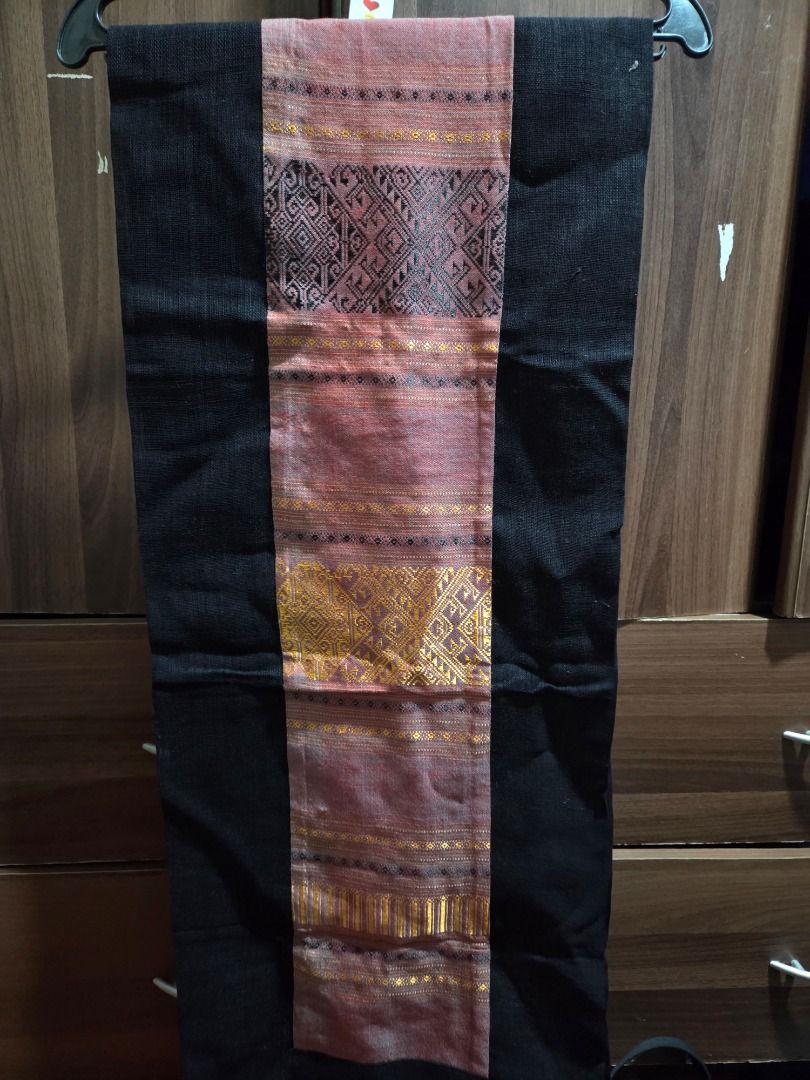 Handwoven Table Runner with Black Borders (Category: Table Linen & Textiles) located in Quezon City. Submitted by lafontanabuonafortuna (Listing ID 1454520716, Image 2). Description: - Beautiful handwoven table runner - Features intricate green and gold patterns - Solid black borders for a striking contrast - Adds a unique touch to any table setting - Ideal for home decor or as a thoughtful gift Take all 3 for 3000 php .