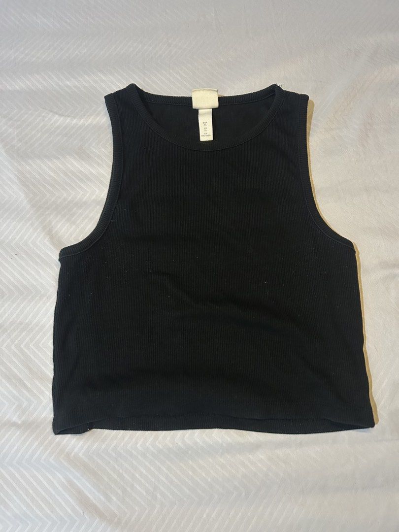 H&M Ribbed Tank Top Black (Category: Sleeveless) located in Manila. Submitted by fromrie (Listing ID 1454504598, Image 1). Description: - Basic black ribbed tank top from H&M - Sleeveless with a classic crew neck - Stretchy material for ultimate comfort - Versatile: great for layering or wearing alone - Effortlessly matches any outfit s-m.