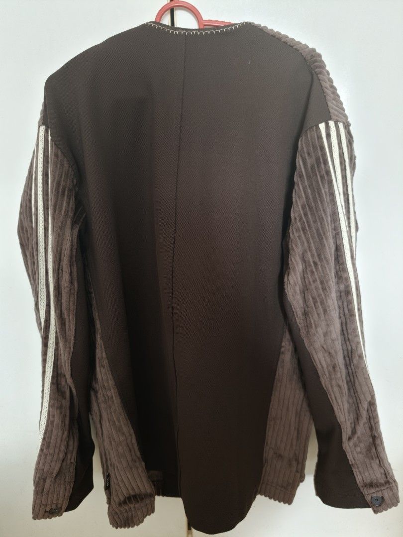 Jacket (Category: Coats, Jackets and Outerwear) located in Singapore. Submitted by ptan (Listing ID 1454442413, Image 2). Description: - Brand: Adidas - Size: M (loose fit) - Color: Brown - Material: Corduroy - Features: Classic Adidas three stripes on sleeves, unique tie closure, kimono-inspired design - Condition: good as new. .