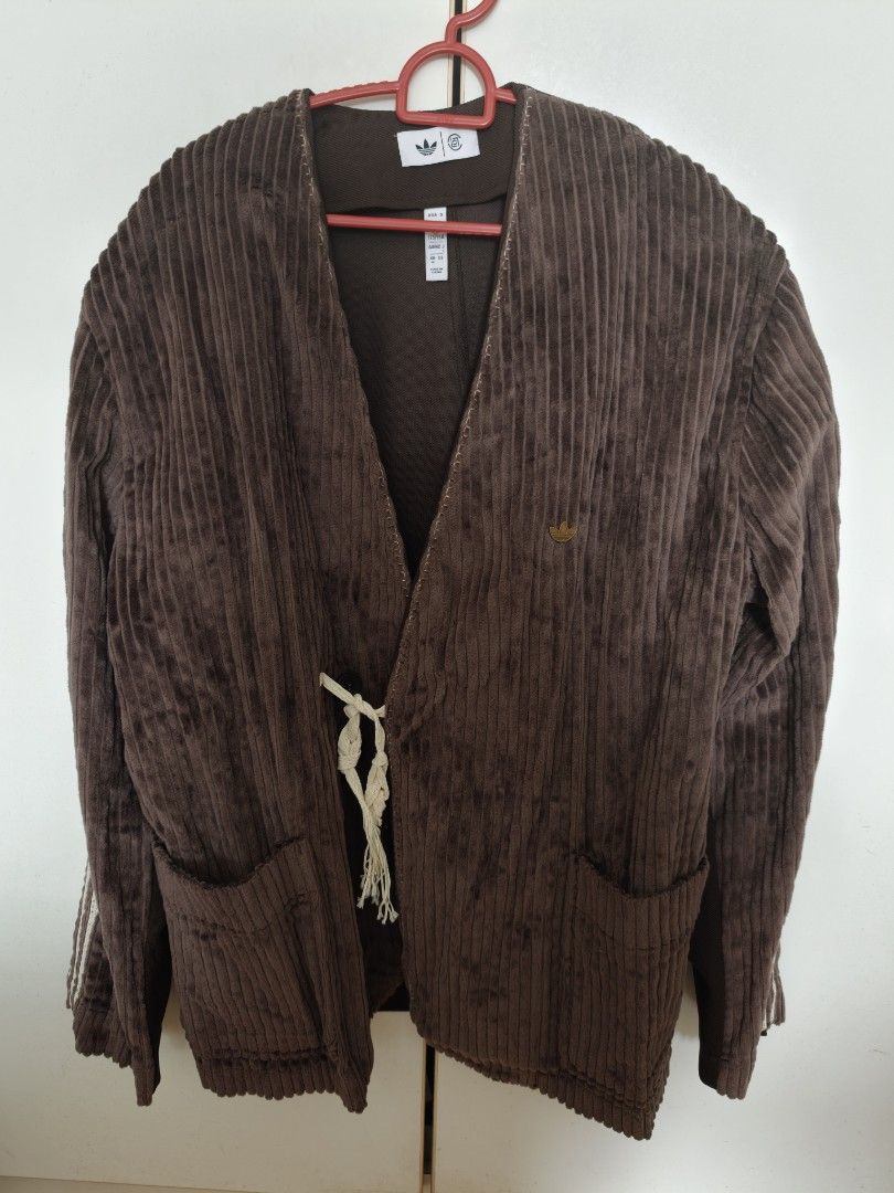 Jacket (Category: Coats, Jackets and Outerwear) located in Singapore. Submitted by ptan (Listing ID 1454442413, Image 1). Description: - Brand: Adidas - Size: M (loose fit) - Color: Brown - Material: Corduroy - Features: Classic Adidas three stripes on sleeves, unique tie closure, kimono-inspired design - Condition: good as new. .