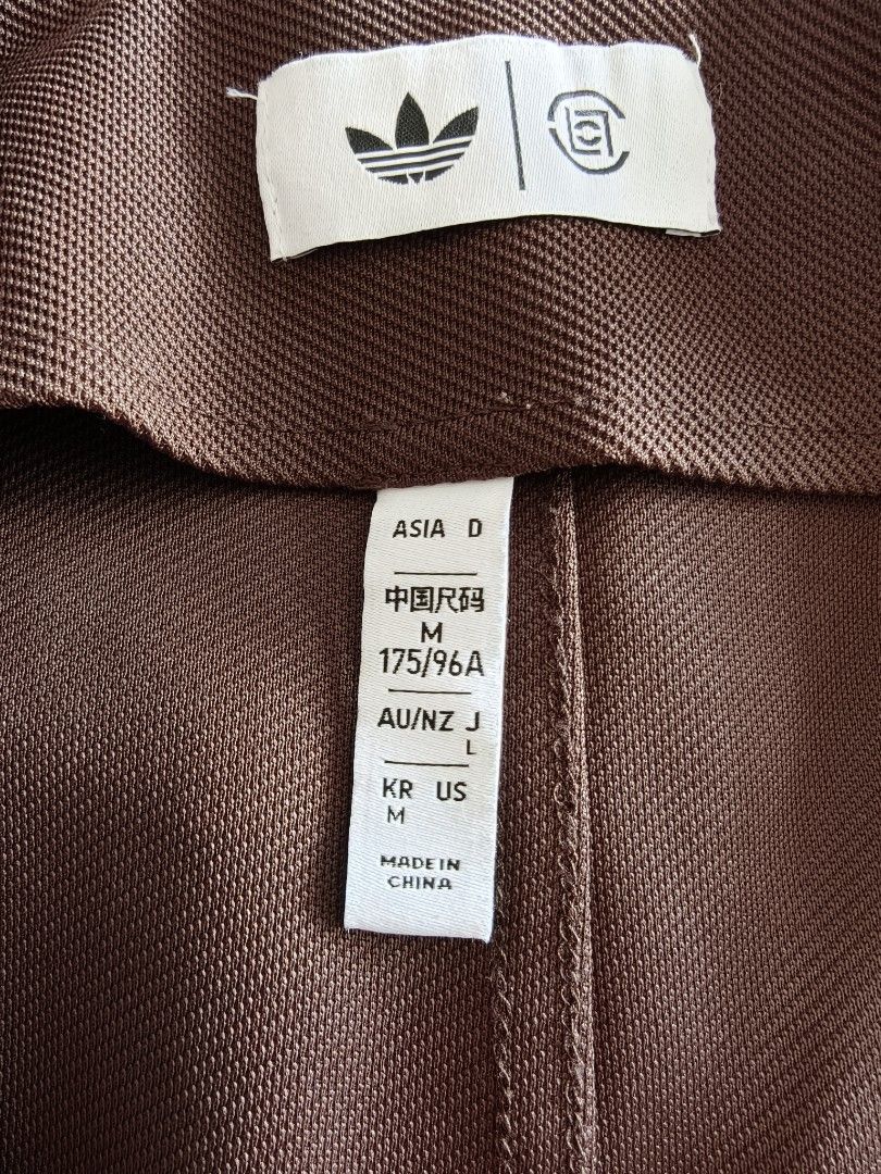 Jacket (Category: Coats, Jackets and Outerwear) located in Singapore. Submitted by ptan (Listing ID 1454442413, Image 3). Description: - Brand: Adidas - Size: M (loose fit) - Color: Brown - Material: Corduroy - Features: Classic Adidas three stripes on sleeves, unique tie closure, kimono-inspired design - Condition: good as new. .