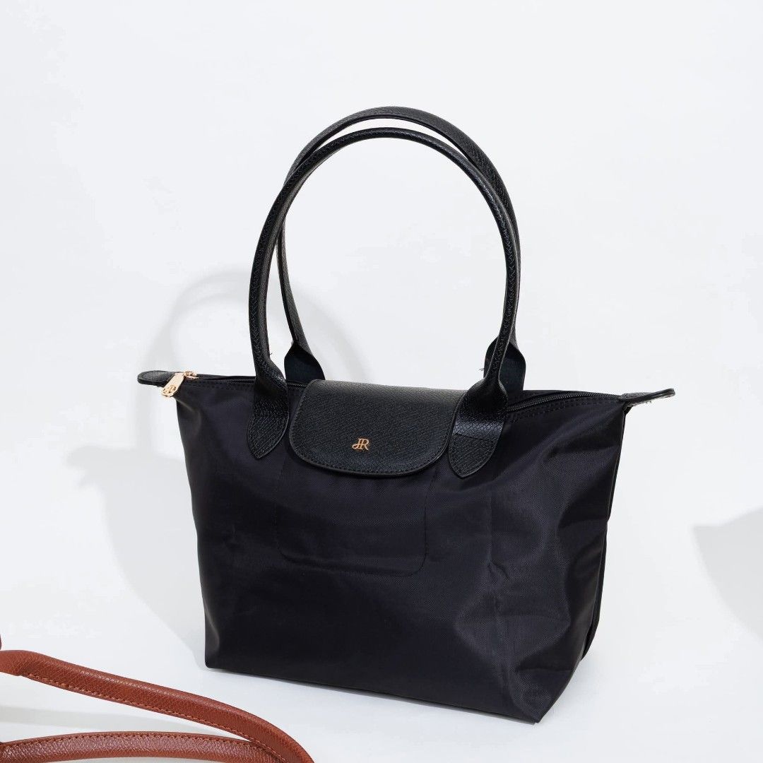 Jira Tote Bag (SHERLYN) (Category: Tote Bags) located in Navotas City. Submitted by sellmystuff2 (Listing ID 1454367148, Image 2). Description: JIRA is a THAILAND BRAND for bags Brandnew with tag , ziplock and ecobag Nylon type Same style to Longchamp Medium Long Handle 2 pcs. available ✅All Black ✅BlackBrown READY TO SHIP ✅✅.