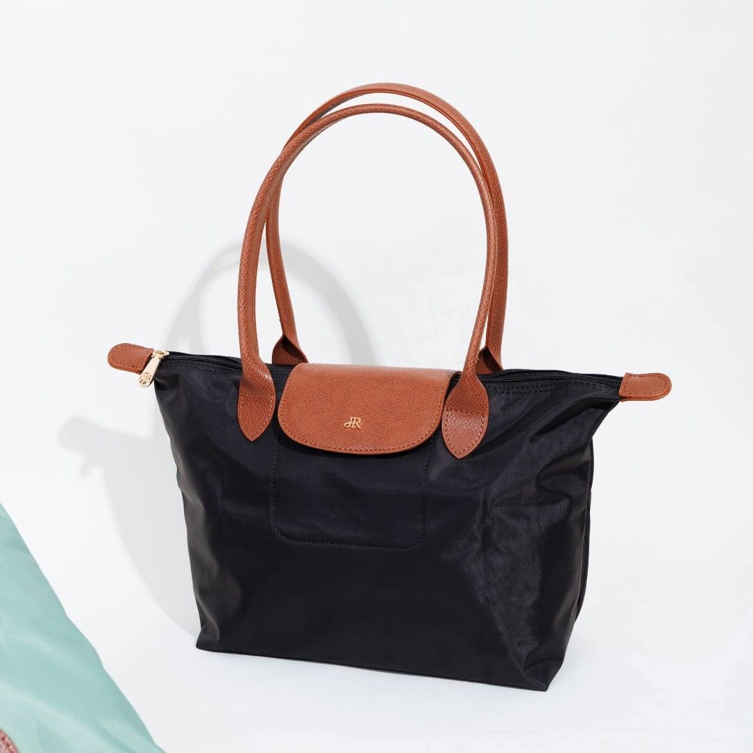 Jira Tote Bag (SHERLYN) (Category: Tote Bags) located in Navotas City. Submitted by sellmystuff2 (Listing ID 1454367148, Image 3). Description: JIRA is a THAILAND BRAND for bags Brandnew with tag , ziplock and ecobag Nylon type Same style to Longchamp Medium Long Handle 2 pcs. available ✅All Black ✅BlackBrown READY TO SHIP ✅✅.