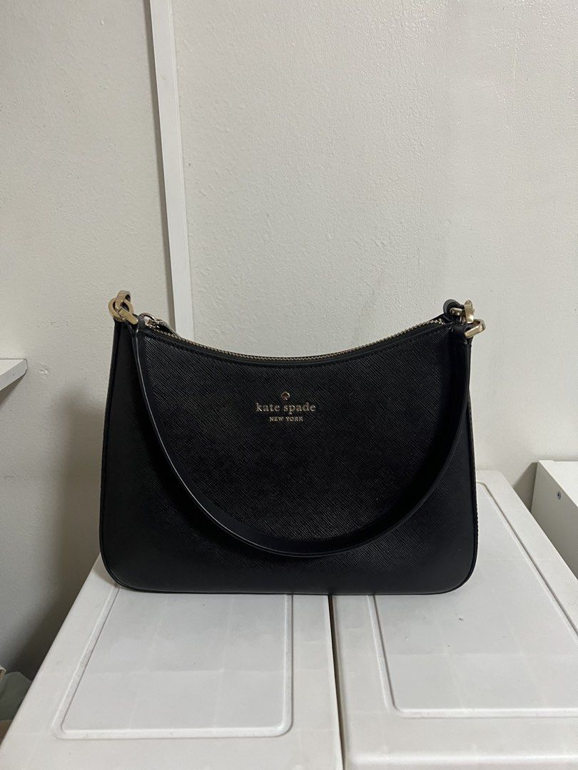 Kate Spade sling bag (Category: Luxury Bags & Wallets) located in Makati City. Submitted by tinajuancho (Listing ID 1454465934, Image 1). Description: - Brand: Kate Spade New York - Material: Black Leather - Style: Shoulder Bag - Design: Classic curved top, single strap - Closure: Zipper - Hardware: Gold-tone - Features: Simple, chic, versatile for everyday or dressing up.