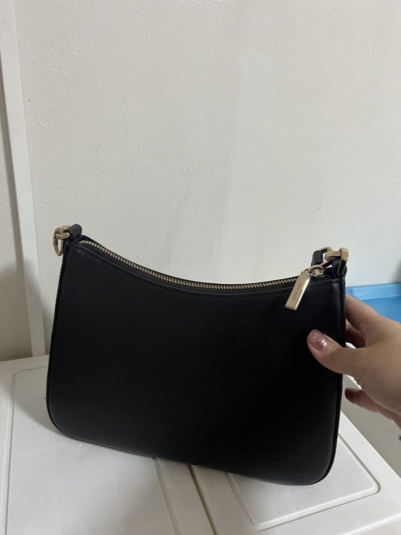 Kate Spade sling bag (Category: Luxury Bags & Wallets) located in Makati City. Submitted by tinajuancho (Listing ID 1454465934, Image 3). Description: - Brand: Kate Spade New York - Material: Black Leather - Style: Shoulder Bag - Design: Classic curved top, single strap - Closure: Zipper - Hardware: Gold-tone - Features: Simple, chic, versatile for everyday or dressing up.