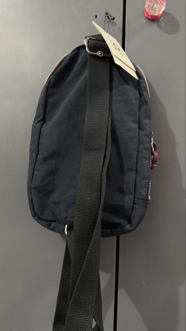 Kipling Navy Blue Mini Backpack with Monkey Charm (Category: Backpacks) located in Quezon City. Submitted by dendionlineshop (Listing ID 1454518598, Image 2). Description: - Navy blue Kipling mini backpack - Front zip pocket - Classic Kipling monkey charm included - Adjustable straps for a comfortable fit - Small and compact, ideal for everyday use or travel.
