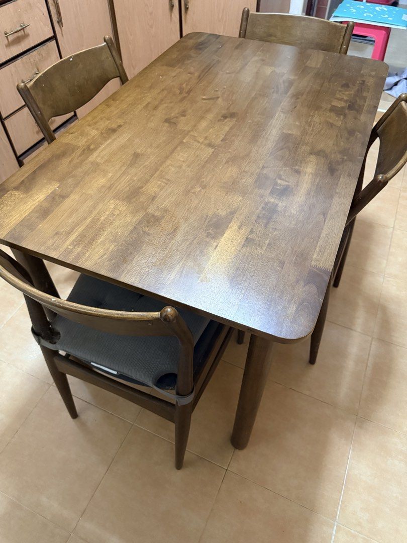 Kitchen dining table (Category: Tables & Sets) located in Singapore. Submitted by nurnorfa (Listing ID 1454476044, Image 1). Description: Selling a wooden dining table with 4 matching chairs. Table is still sturdy and good condition. Spacious rectangular table top Chairs are still sturdy and usable Cushion seats have tear and need upholstering. Self collection at Bukit batok. .