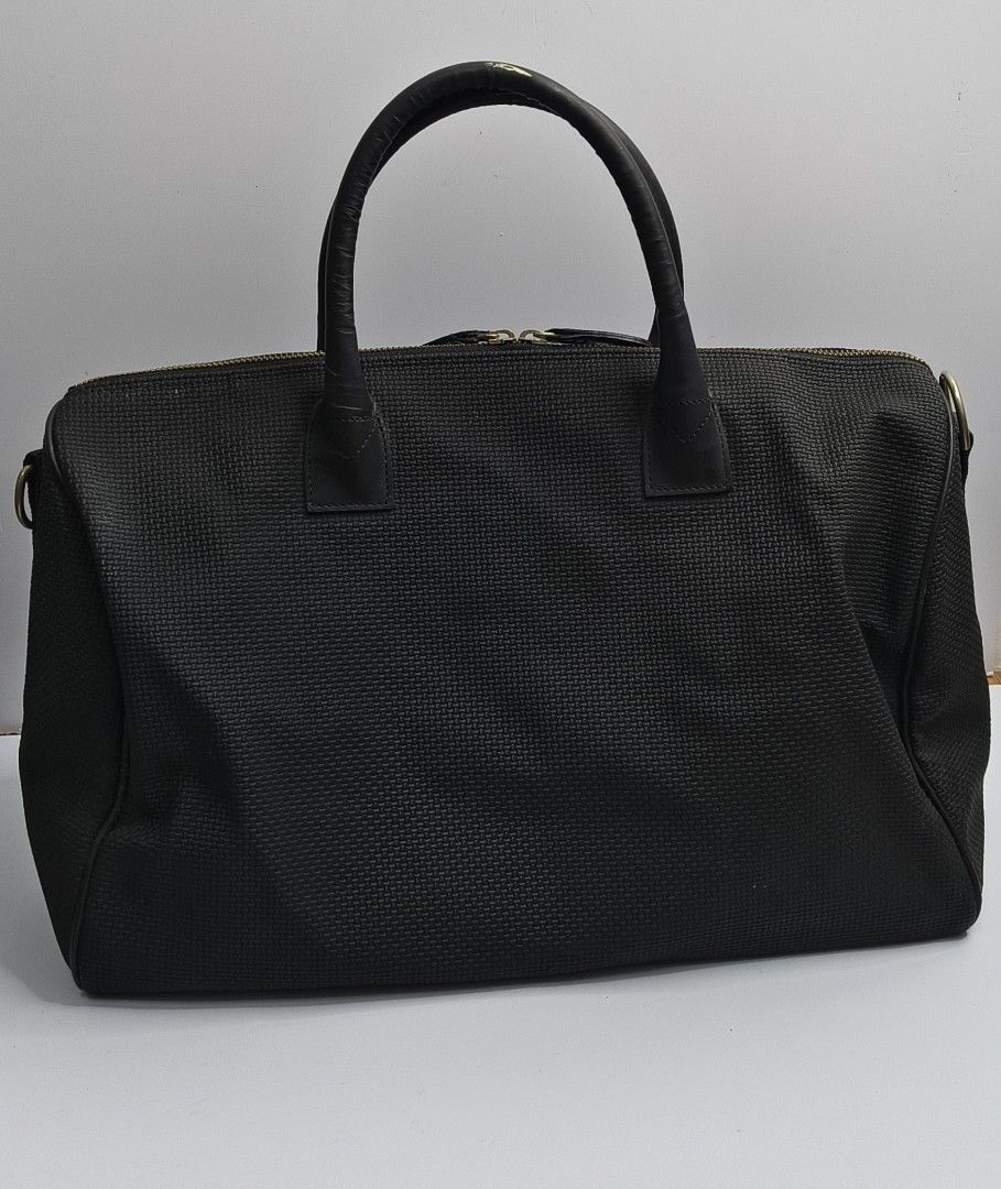 La Veé Black Woven Weekender Bag (Category: Briefcases) located in Baguio. Submitted by PreiLoveMaria (Listing ID 1454457031, Image 3). Description: La Veé Black Woven Weekender Bag Designed with a textured woven exterior, sleek black leather handles, and gold-tone hardware, it opens up to a vibrant yellow interior with multiple organizational pockets. Perfect for short trips, staycations, or as a carry-on ​Item Details: ​Brand: La Veé ​Dimension