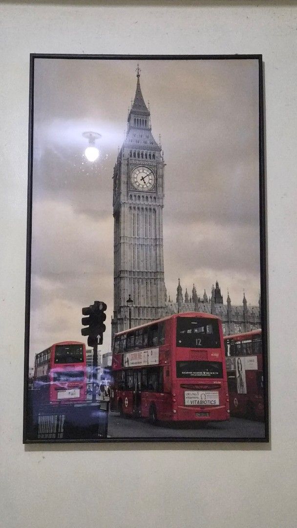 London Big Ben Red Bus Framed Wall Art (Category: Wall Decor) located in Manila. Submitted by bravewaters (Listing ID 1454533786, Image 1). Description: - Original price: ₽3499.75 - Dimensions: 40 x 24.5 inches / 101.6 x 62.23 cm - Iconic London scene featuring Big Ben and red double-decker buses. - Classic black and white print with striking red accents. - Perfect for adding a city vibe to your space. - Comes ready to hang..