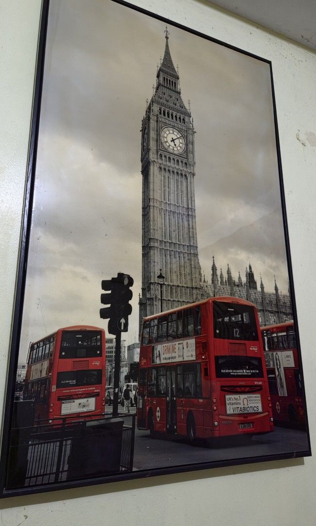 London Big Ben Red Bus Framed Wall Art (Category: Wall Decor) located in Manila. Submitted by bravewaters (Listing ID 1454533786, Image 2). Description: - Original price: ₽3499.75 - Dimensions: 40 x 24.5 inches / 101.6 x 62.23 cm - Iconic London scene featuring Big Ben and red double-decker buses. - Classic black and white print with striking red accents. - Perfect for adding a city vibe to your space. - Comes ready to hang..