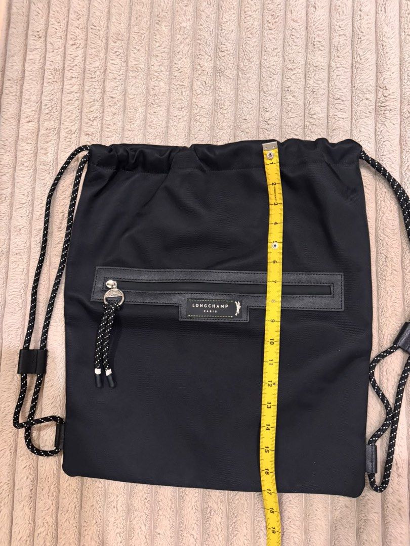 Longchamp Paris Black Nylon Drawstring Backpack (Category: Backpacks) located in Paranaque City. Submitted by mjclosetph17 (Listing ID 1454559398, Image 1). Description: 🎒 Longchamp Green District Medium Drawstring Backpack Brand New / Never Used ✨ 💚 Green | Lightweight fabric + leather details 📏 Size: 15”W × 17”H × 2”D ✔️ Never used, stored only ✔️ No visible dirt/stains ✔️ No holes, tears, rubs or flaws 🎁 Authenticity Disclosure: Received a