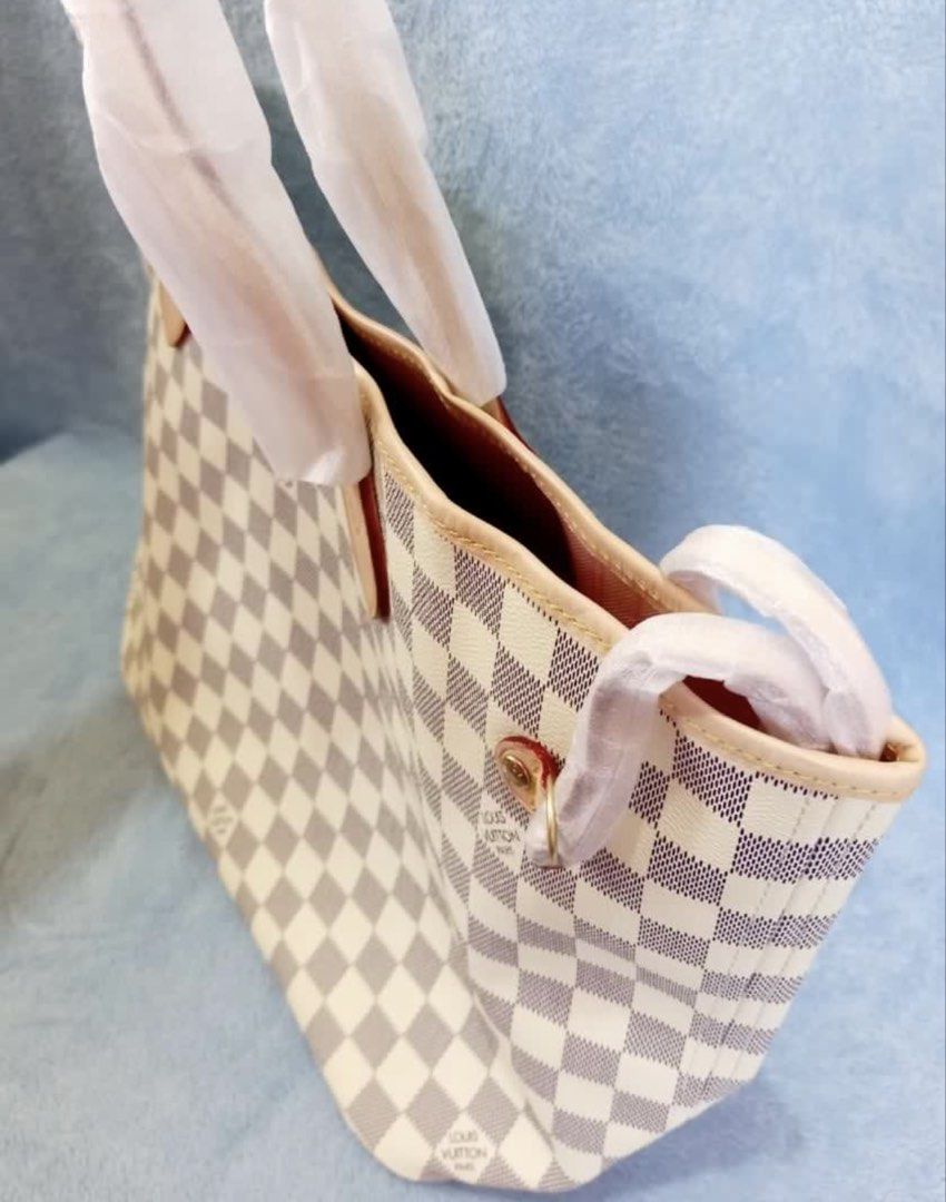 LV Damier Azur Neverfull MM Tote Bag (Category: Luxury Bags & Wallets) located in Pasig City. Submitted by zen_it_all (Listing ID 1454559874, Image 3). Description: - LV tote bag (for self authentication) - Classic Damier Azur canvas - Chic pink interior - Comes with a matching pouch - Spacious and ideal for everyday use or travel -with dust bag -plus SF (no rush shipping).