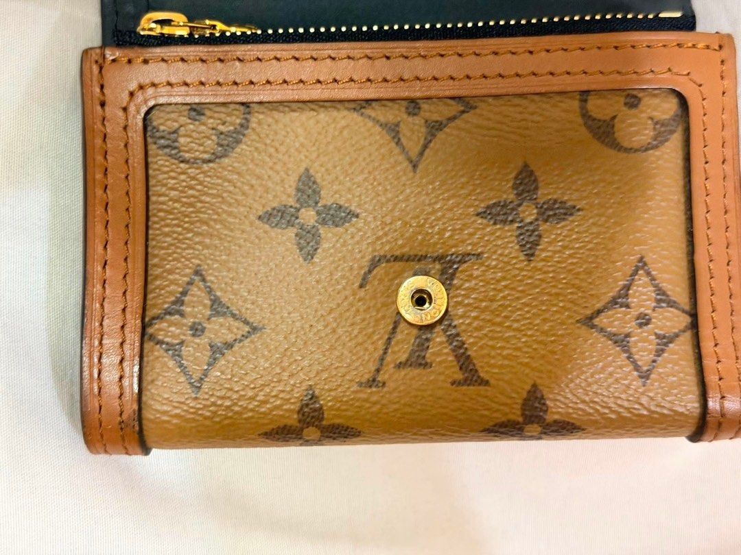 Louis Vuitton Dauphine Compact Wallet (Category: Luxury Bags & Wallets) located in San Pedro. Submitted by closetbyiya_ (Listing ID 1454505834, Image 3). Description: - Authentic Louis Vuitton wallet - Priced for 60k, selling for 30k - RFS: Upgrade - Can do meetups around Alabang, BGC areas.