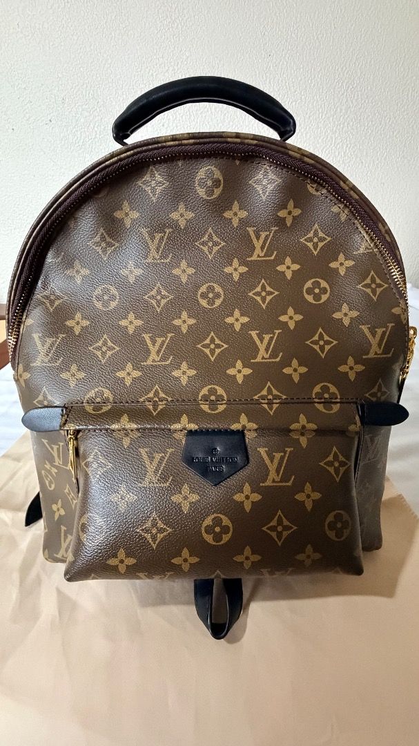 Louis Vuitton Monogram Canvas Palm Springs Mini Backpack (Category: Luxury Bags & Wallets) located in Caloocan City. Submitted by prof_music1979 (Listing ID 1454387331, Image 1). Description: Model: Palm Springs Reference: M44873 Canvas: Classic LV Monogram-coated canvas Trim: Black leather Hardware: Gold-tone Straps: Black leather Top handle: Black Front pocket: Yes Black LV Paris leather tab: Yes.