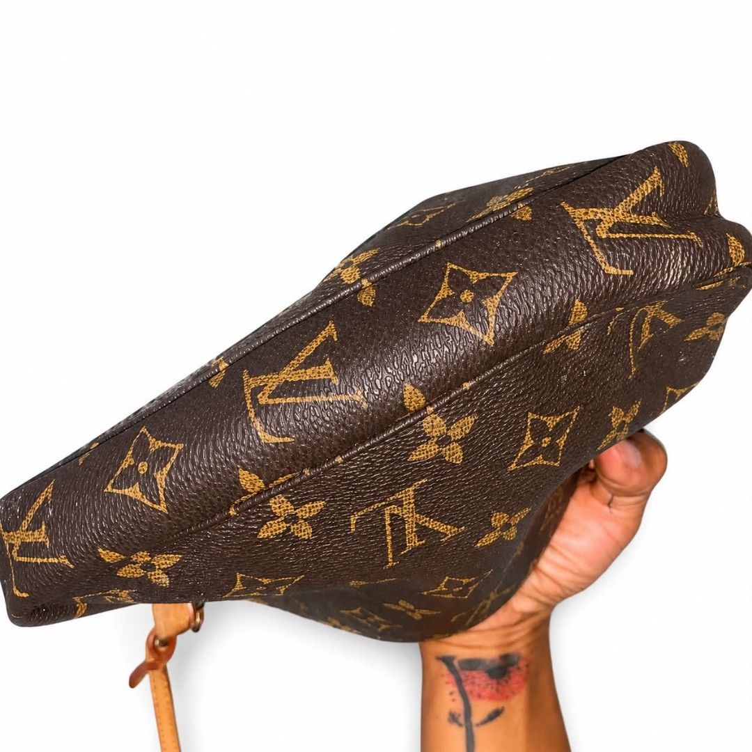 Louis Vuitton Monogram Pouch Bag (Category: Luxury Bags & Wallets) located in Naawan. Submitted by gentlemountain.32545c (Listing ID 1454452567, Image 3). Description: - Authentic Louis Vuitton pouch bag - Classic monogram canvas - Leather strap and trim - Zipper closure - Made in France - Ideal for carrying essentials - Small and compact design.