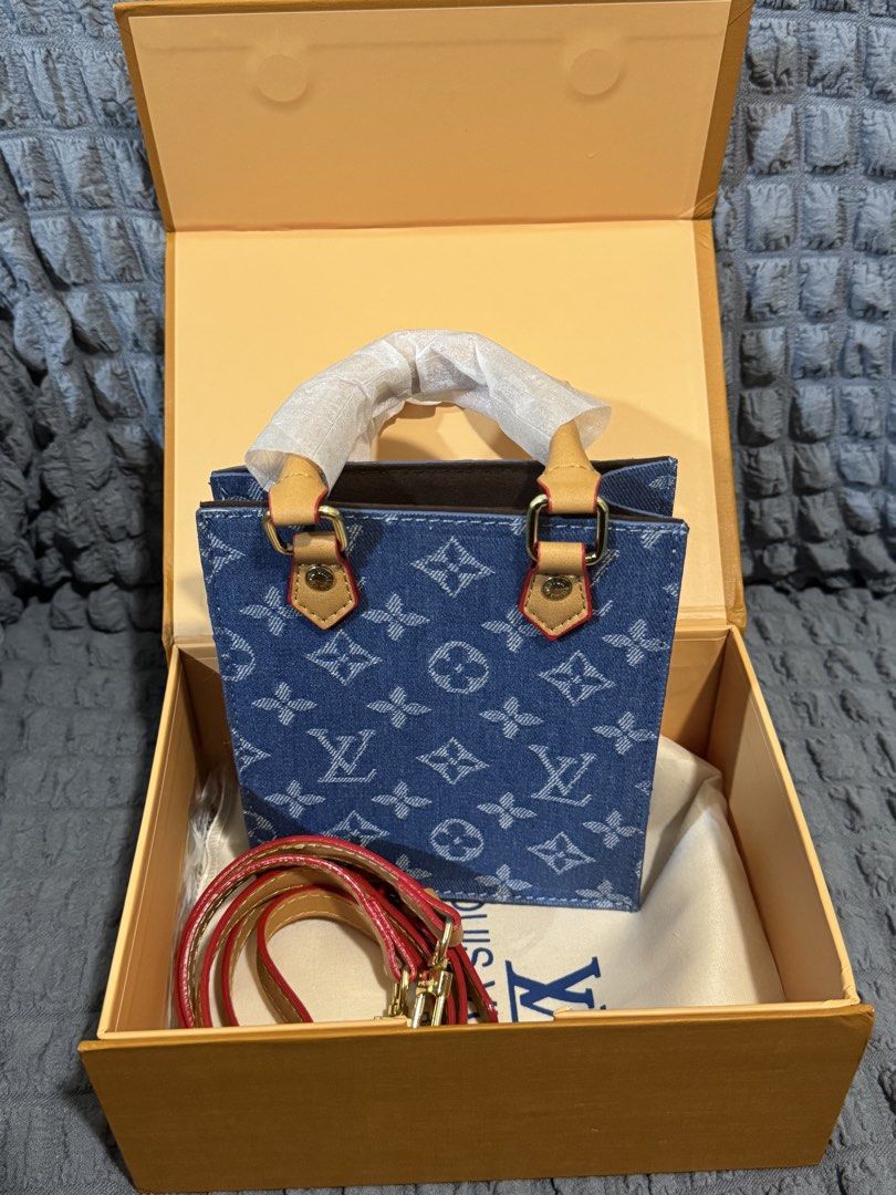 L.V. Monogram Denim Mini Bag (Category: Luxury Bags & Wallets) located in Manila. Submitted by mcjge (Listing ID 1454375021, Image 2). Description: - Super cute Louis Vuitton mini bag - Stylish monogram denim design - Features a detachable strap for versatility - Elegant gold hardware details - Ideal size for carrying your essentials - Includes LV box and dustbag.