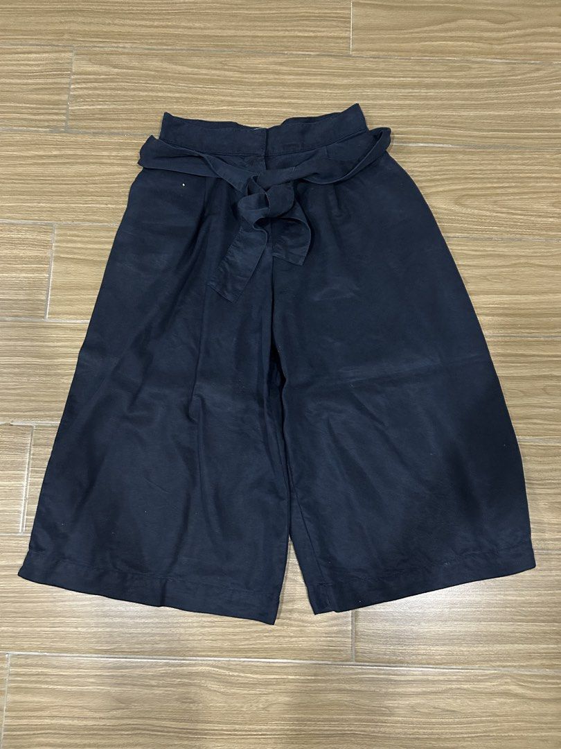 Mango Navy Blue Culottes with Ribbon Belt (Category: Shorts) located in San Juan City. Submitted by curatedbymae (Listing ID 1454397415, Image 1). Description: Item: Mango Navy Blue Culottes with Ribbon Belt - waistline: 26 in. approx - length (waist to bottom): 28 in. Size: XS Mode of payment: GCASH/MAYA Shipping: Grab/Lalamove/J&T (Buyer will shoulder shipping fees.).
