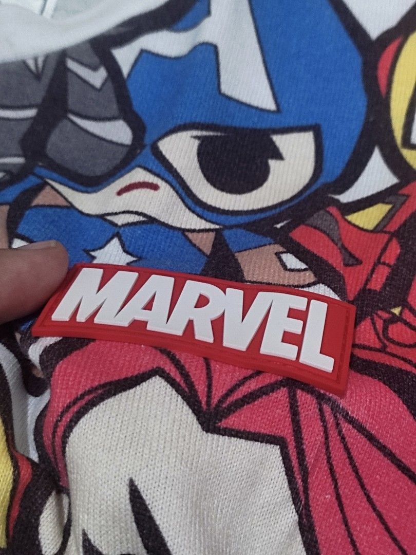 MARVEL x CHOCOOLATE tshirt (Category: Tshirts & Polo Shirts ) located in Abucay. Submitted by adaglai13 (Listing ID 1454407844, Image 3). Description: Brand & Details - Collaboration: :CHOCOOLATE × Marvel ​ - Size: XXS (fits like extra small/teen size, 160/80A) ​ - Material: Soft knit cotton blend, casual lightweight fit ​ - Style: All-over print tee Design & Features - Full print of chibi/cute-style Marvel heroes: Captain America, Iron Man, Hulk