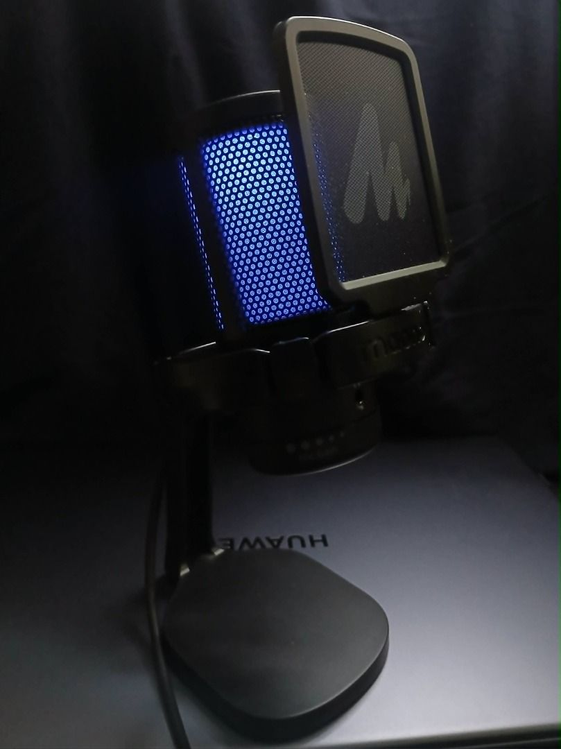Microphone (Maono DGM20 Model) (Category: Microphones) located in Makati City. Submitted by reyginnn (Listing ID 1454398290, Image 1). Description: - Maono USB Microphone with vibrant RGB lighting effects - Choose from Blue, Red, or Rainbow color options - Comes complete with a sturdy stand and pop filter - Perfect for streaming, gaming, and recording - Easy plug-and-play setup for computers.
