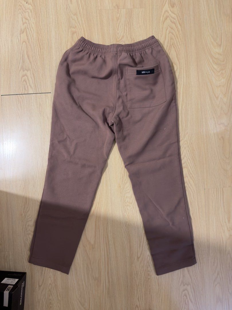 MN+LA Elastic Waist Pants (Category: Joggers) located in Manila. Submitted by arloso (Listing ID 1454548537, Image 2). Description: - Brand: MN+LA - Color: Brown - Features: Elastic waistband for comfort, back pocket with brand logo - Style: Casual, everyday wear - Versatile: Easy to pair with various tops.