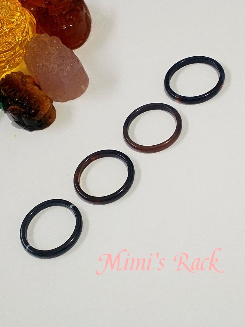 Natural Agate Ring with Certificate of Authenticity (Category: Rings) located in Taguig. Submitted by mimisrack (Listing ID 1454544750, Image 3). Description: 🖤Simple, elegant, and effortlessly timeless. These polished agate rings feature a sleek, smooth band with deep black and dark brown tones. Under light, some pieces reveal a beautiful warm reddish-brown translucency, adding depth and character to the otherwise dark appearance. -Each ring ha