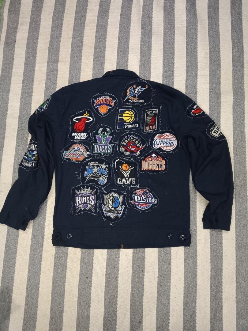 NBA Patch Jacket - Multiple Teams (Category: Coats, Jackets and Outerwear) located in Kuala Lumpur. Submitted by truemountain-348cda (Listing ID 1454515057, Image 2). Description: - Unique jacket featuring multiple NBA team patches (Lakers, Bulls, Celtics, Raptors, etc.) pit22/lbuh 27 - Distressed edges on patches for a vintage, edgy look - Zipper front closure - Long sleeves - Ideal for any passionate basketball fan.