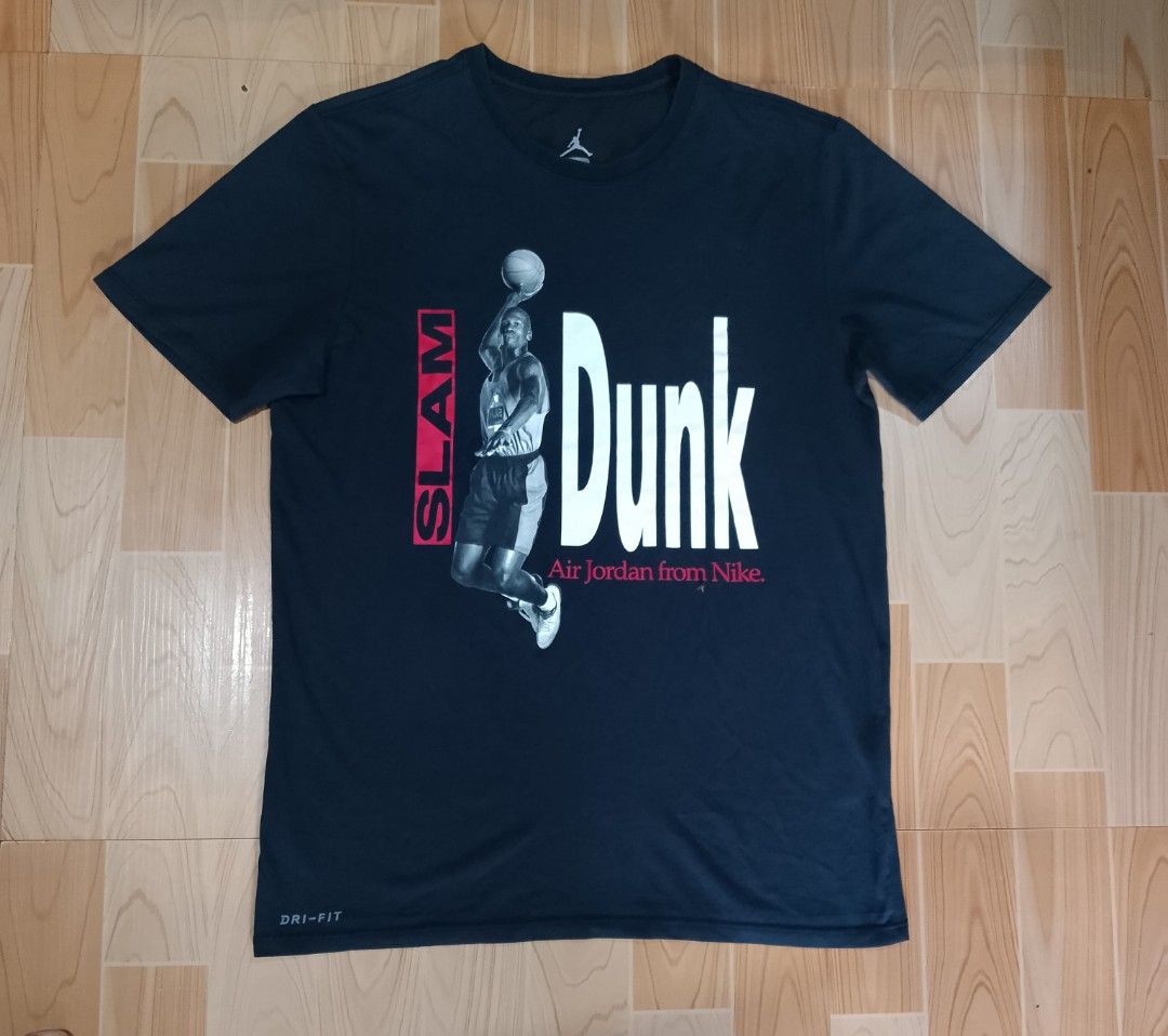 Nike Jordan Slam Dunk T-Shirt (Category: Tshirts & Polo Shirts ) located in San Jose del Monte. Submitted by azetor (Listing ID 1454377690, Image 1). Description: - Black Nike Jordan T-shirt - Features Michael Jordan mid-dunk graphic with 'Slam Dunk' text - Made with Dri-FIT material for comfort and performance - Size: Medium on tags - Ideal for any basketball enthusiast - measurements - chest 19.5 - length 27 - great condition - color rate 9.5/1