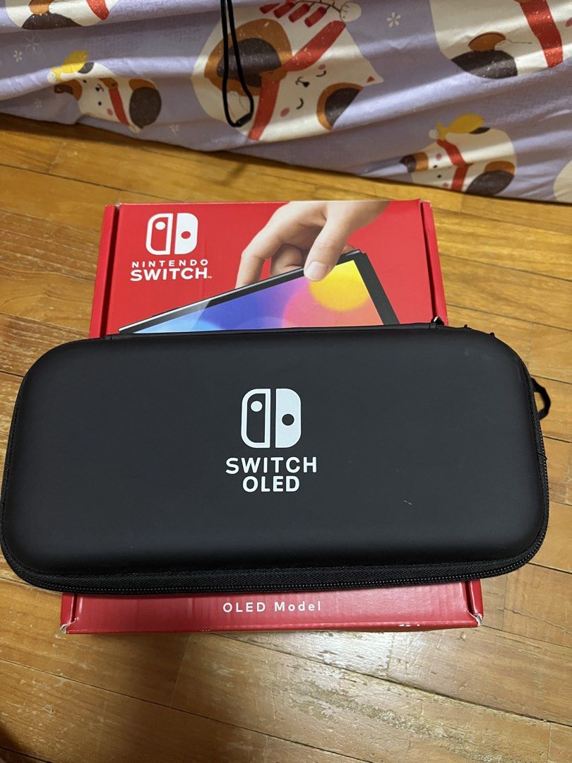 Nintendo Oled (Category: Nintendo) located in Singapore. Submitted by adventurerjk (Listing ID 1454369607, Image 2). Description: Got this switch for 2 year plus. Hardly use Comes with full box, case and screen protector ***NO GAMES INCLUDED***.