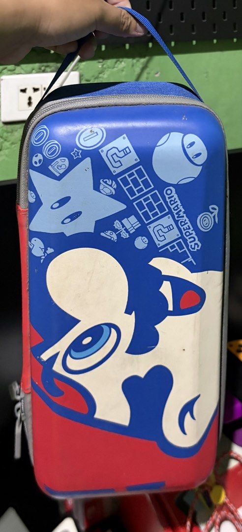 Nintendo Switch Accessories (Category: Controllers) located in Manila. Submitted by mimimitol (Listing ID 1454403831, Image 3). Description: For sale! - Black Large Travel Bag : 1k - Mario Travel Bag : 800 - IINE Mario Controller : 2k Take all for 3.5k.