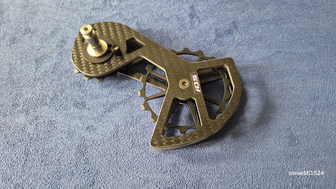 Oversized Pulley kit for Shimano 105 (Category: Bicycles) located in Bantay. Submitted by backyardcyclist (Listing ID 1454488578, Image 3). Description: - 105 Pulley wheel kit - replacement kit gor Shimano 105 - Lightweight and strong carbon fiber construction - Oversized pulley cage for improved performance - Distinct carbon weave pattern - Includes jockey wheels - Designed for Shimano drivetrains - Great bike upgrade - Please check photos for d
