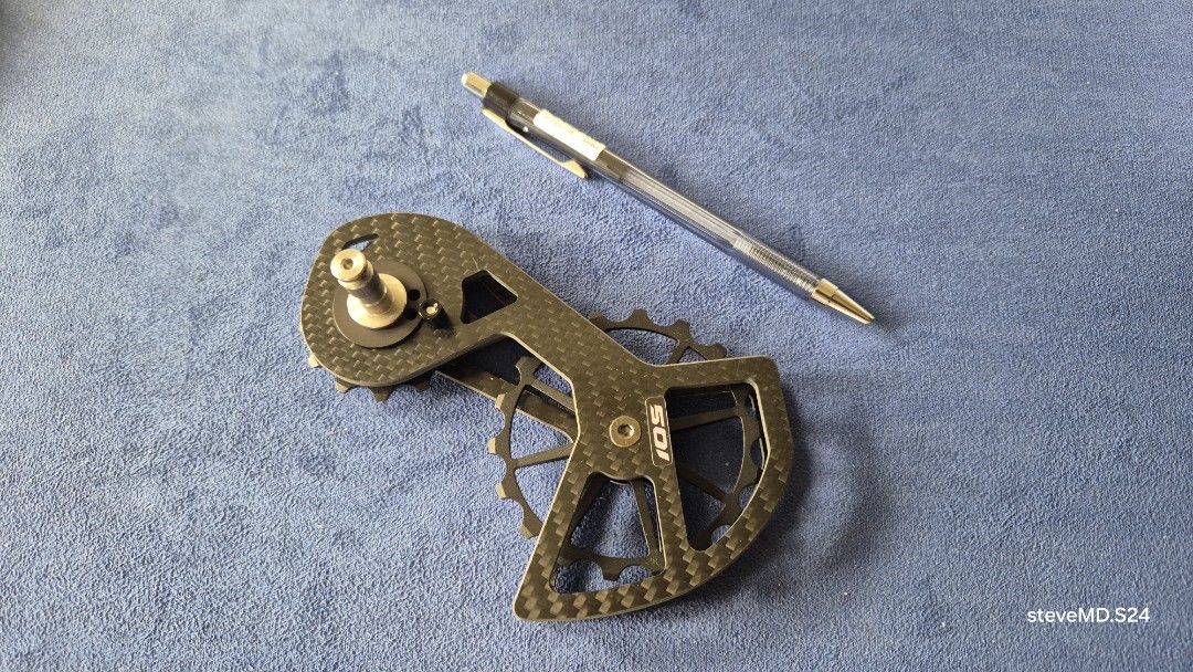Oversized Pulley kit for Shimano 105 (Category: Bicycles) located in Bantay. Submitted by backyardcyclist (Listing ID 1454488578, Image 2). Description: - 105 Pulley wheel kit - replacement kit gor Shimano 105 - Lightweight and strong carbon fiber construction - Oversized pulley cage for improved performance - Distinct carbon weave pattern - Includes jockey wheels - Designed for Shimano drivetrains - Great bike upgrade - Please check photos for d