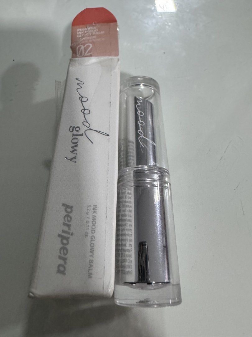 Peripera Ink Mood Glowy Balm 02 Cherry Brunch (Category: Makeup) located in Manila. Submitted by decluterthings888 (Listing ID 1454485796, Image 3). Description: - Peripera Ink Mood Glowy Balm - Shade: 02 Cherry Brunch - Finish: Glossy - Color: Natural peachy-pink - Packaging: Sleek silver - Perfect for everyday wear - Includes original box.