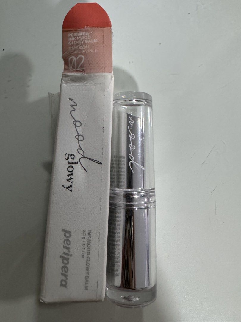 Peripera Ink Mood Glowy Balm 02 Cherry Brunch (Category: Makeup) located in Manila. Submitted by decluterthings888 (Listing ID 1454485820, Image 3). Description: - Peripera Ink Mood Glowy Balm - Shade: 02 Cherry Brunch - Type: Hydrating lip balm - Finish: Glossy - Packaging: Sleek silver tube with clear cap - Includes original box - Ideal for a natural, hydrated lip look.