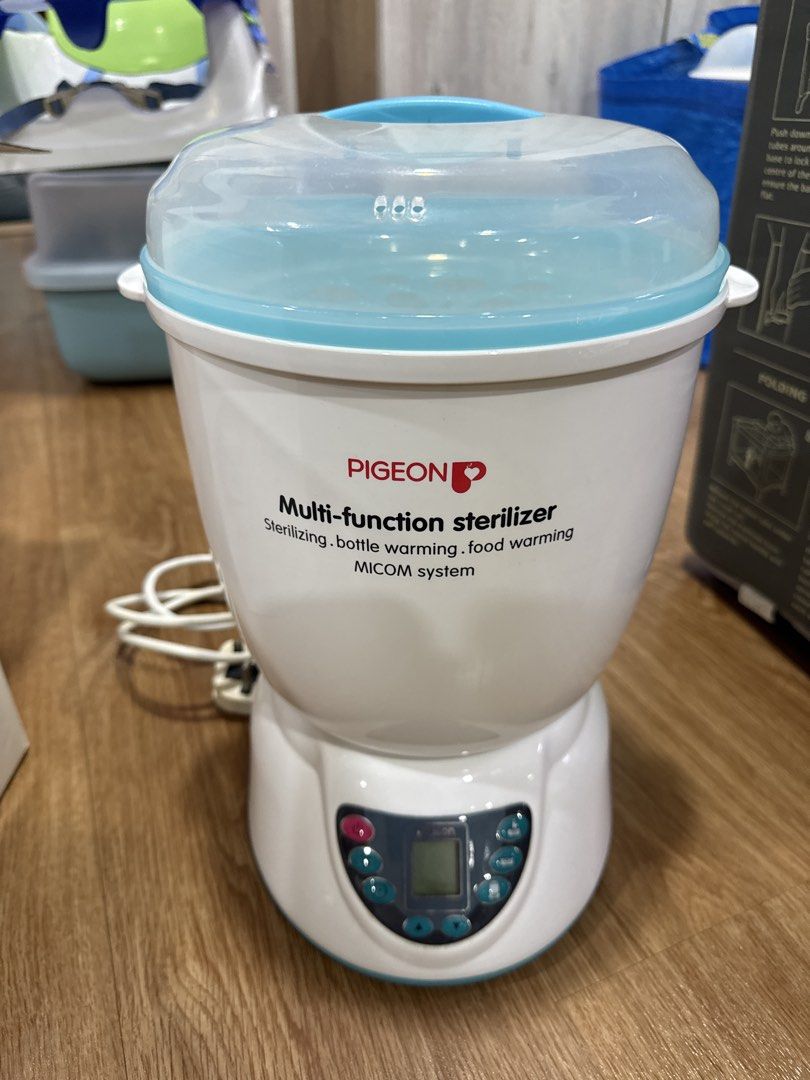 Pigeon Multi-function Sterilizer (Category: Breastfeeding & Bottle Feeding) located in Singapore. Submitted by laconic84 (Listing ID 1454472475, Image 2). Description: - Brand: Pigeon - Model: Multi-function Sterilizer - Functions: Sterilizing, Bottle Warming, Food Warming - Sterilization Cycle: Fast 9 minutes - Capacity: Accommodates up to 5 standard or side-neck bottles - Features: MICOM system - Condition: Good, pre-loved - Suitable for all ty