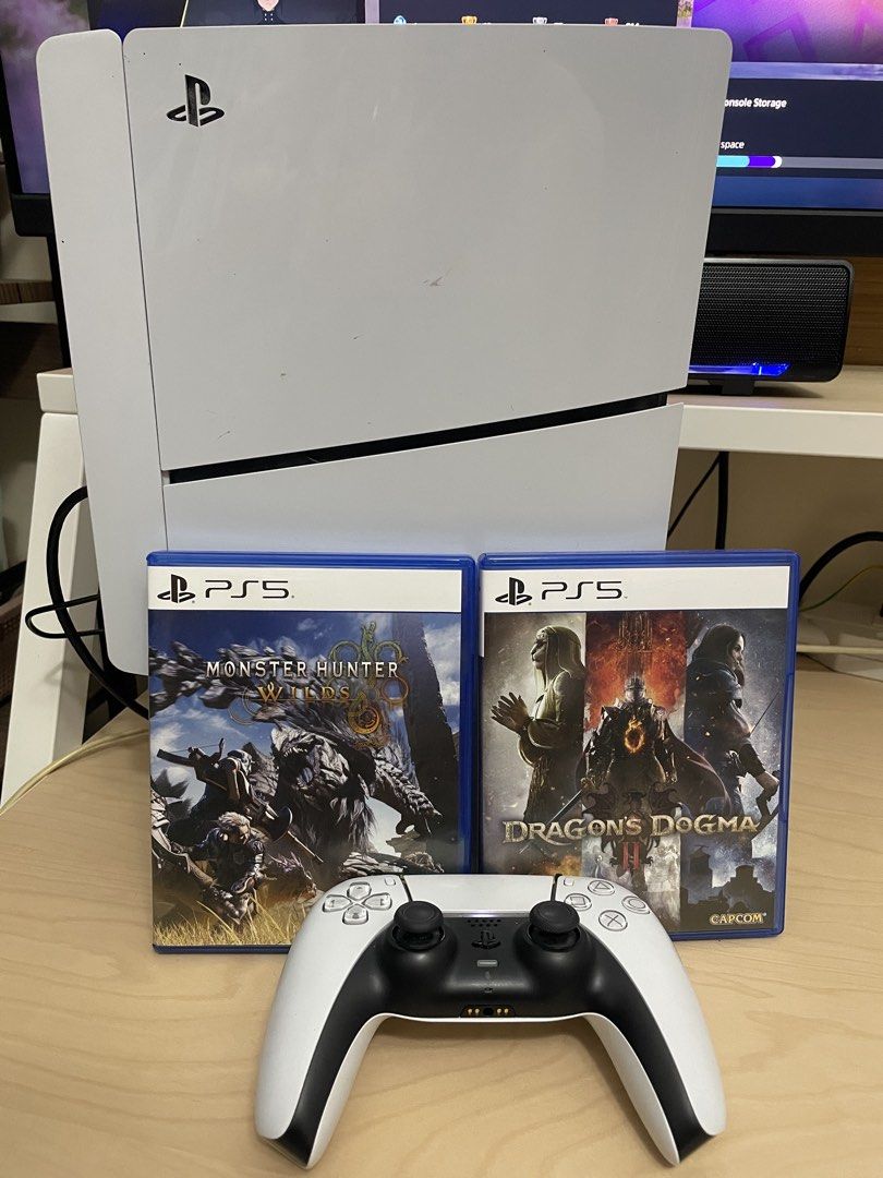 PlayStation 5 Console with 2 Games and Controller (Category: PlayStation) located in Manila. Submitted by raaronpre73222 (Listing ID 1454389788, Image 2). Description: - PS5 Console - Includes 2 Games: Monster Hunter & Dragon's Dogma - 1 DualSense Wireless Controller - Minor scuffs on front panel (visible in photos) - Games and controller in good working condition - Ready for your next gaming adventure!.