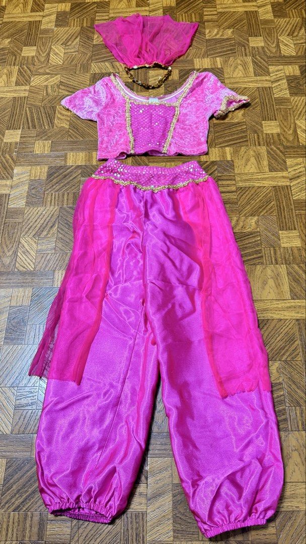 Princess Jasmine Costume (Category: Babies & Kids Fashion) located in Quezon City. Submitted by frappes (Listing ID 1454432700, Image 1). Description: - Aladdin-inspired Pink Princess Costume - Set includes: sparkly top with gold trim, pants with sheer overlay, and headpiece - Perfect for dress-up and parties - Made in USA - Fits sizes 4-6.