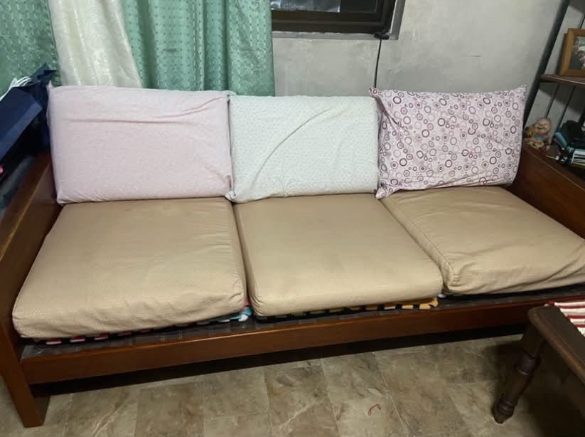 Pure Narra Sofa (Category: Sofas) located in Quezon City. Submitted by nathaliedychiao (Listing ID 1454557955, Image 2). Description: Solid wood sofa bed with cushions, pillows, and mattress topper. Features wooden backrest slats. Perfect for lounging or as an extra bed..