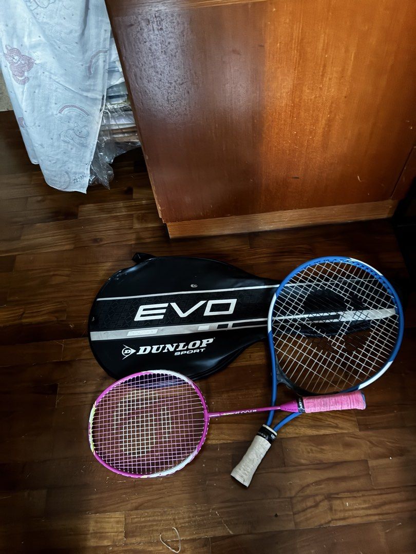 Racket (Category: Racket & Ball Sports) located in Singapore. Submitted by limsenghok2025 (Listing ID 1454473542, Image 1). Description: - Includes one pink badminton racket and one blue tennis racket. - Comes with a Dunlop 'EVO' racket bag. - Ideal for casual badminton or tennis sessions. - Meetup available at Euphony Gardens or A&A Banana Leaf Restaurant..