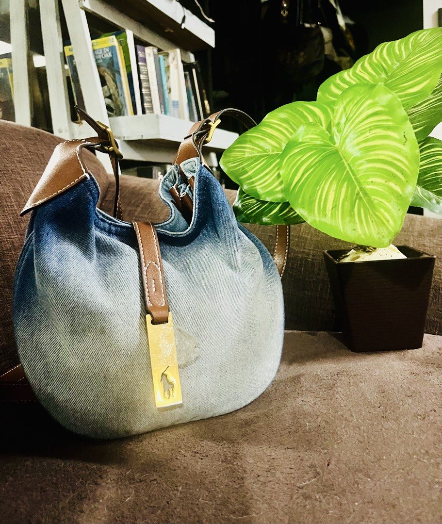 Ralph Lauren (Category: Luxury Bags & Wallets) located in Quezon City. Submitted by retann (Listing ID 1454391099, Image 1). Description: - Cute Ralph Lauren shoulder bag - Denim material with a cool ombre effect (dark blue to light) - Brown leather accents and strap - Signature Ralph Lauren polo player charm - Great for everyday use - Fits essentials.
