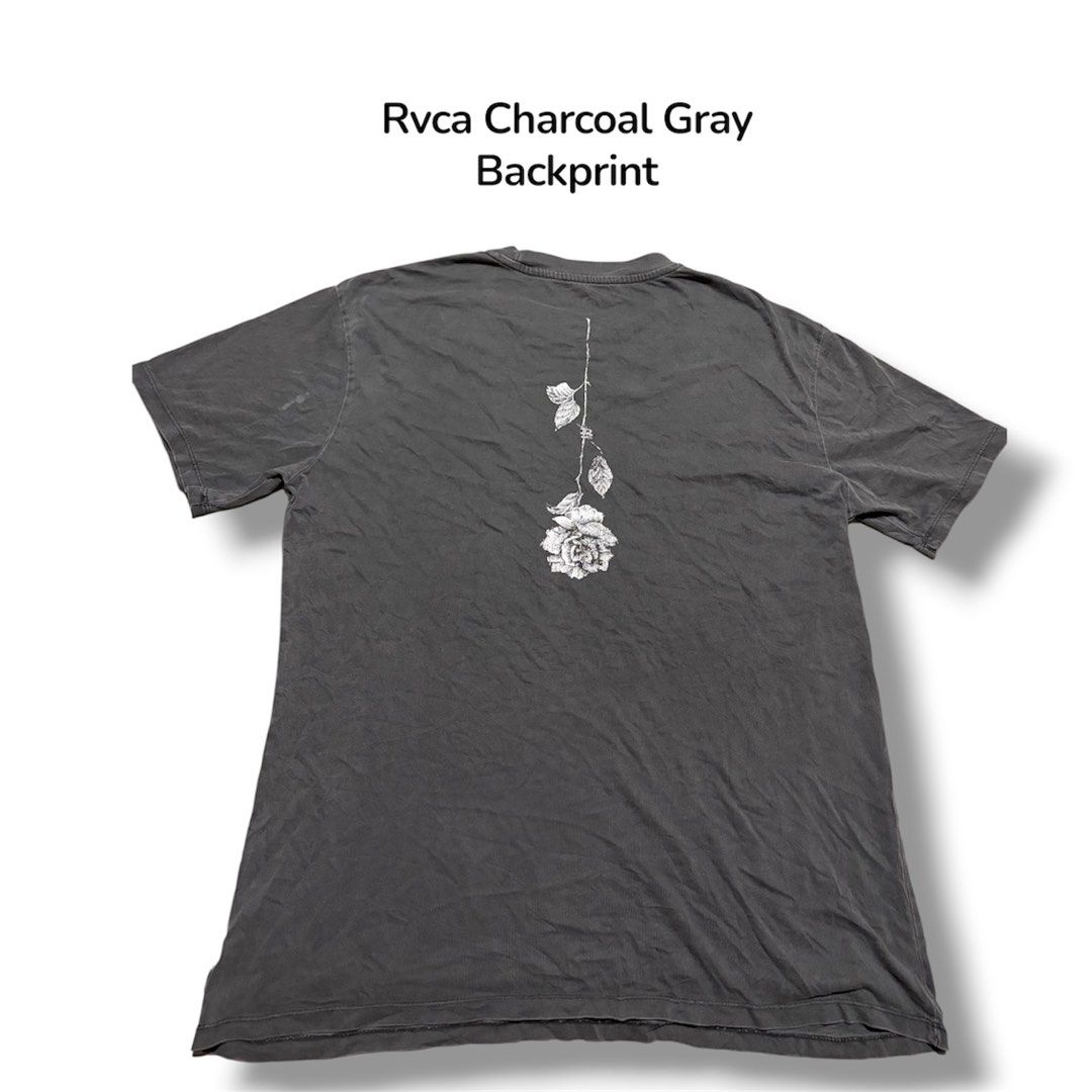 RVCA Charcoal Gray T-Shirt with Backprint - Medium (Category: Tshirts & Polo Shirts ) located in Guihulngan. Submitted by fbthriftgoodsniace (Listing ID 1454398618, Image 2). Description: - RVCA T-shirt in Charcoal Gray - Features a small RVCA logo on the front - Eye-catching rose graphic design on the back - Measurements: Width 22 inches, Length 29.5 inches.