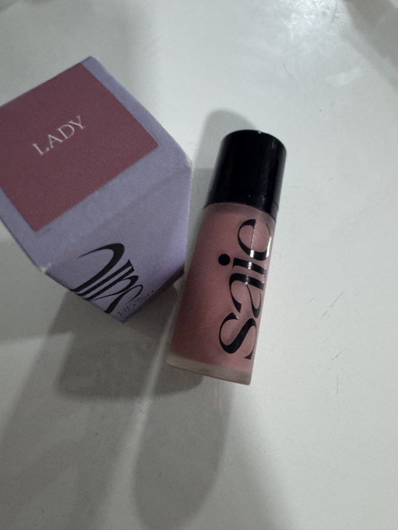 Saie Dew Blush Liquid Cheek Flush in Lady (Category: Makeup) located in Manila. Submitted by decluterthings888 (Listing ID 1454485846, Image 3). Description: - Saie Dew Blush - Shade: Lady - Type: Liquid cheek flush - Size: 12 ml / 0.4 fl oz - Color: Lovely rosy shade - Finish: Great for a natural flush.