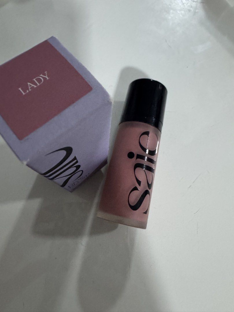 Saie Dew Blush Liquid Cheek Flush in Lady (Category: Makeup) located in Manila. Submitted by decluterthings888 (Listing ID 1454485846, Image 2). Description: - Saie Dew Blush - Shade: Lady - Type: Liquid cheek flush - Size: 12 ml / 0.4 fl oz - Color: Lovely rosy shade - Finish: Great for a natural flush.